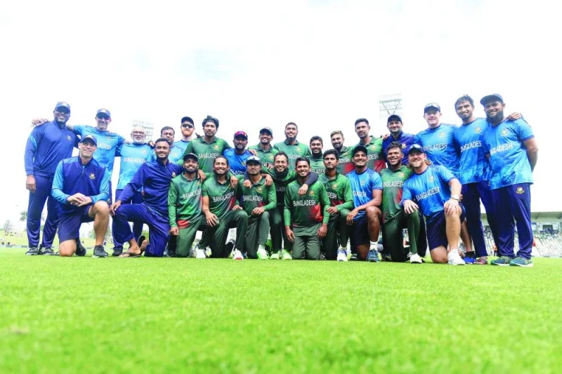 Bangladesh players pose after their win in the third ODI against New Zealand at McLean Park in Napier on Saturday. (AFP)
