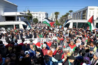 Moroccans wave Palestinian flags during a protest in Rabat on Sunday in solidarity with Gaza.