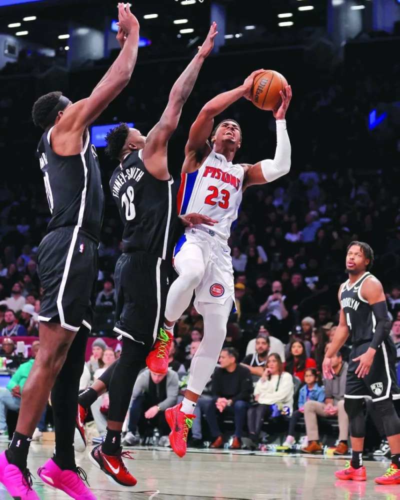 
Detroit Pistons’ Jaden Ivey takes a shot against Brooklyn Nets’ Day’Ron Sharpe and Dorian Finney-Smith during their NBA game at Barclays Center in Brooklyn. (USA TODAY Sports) 