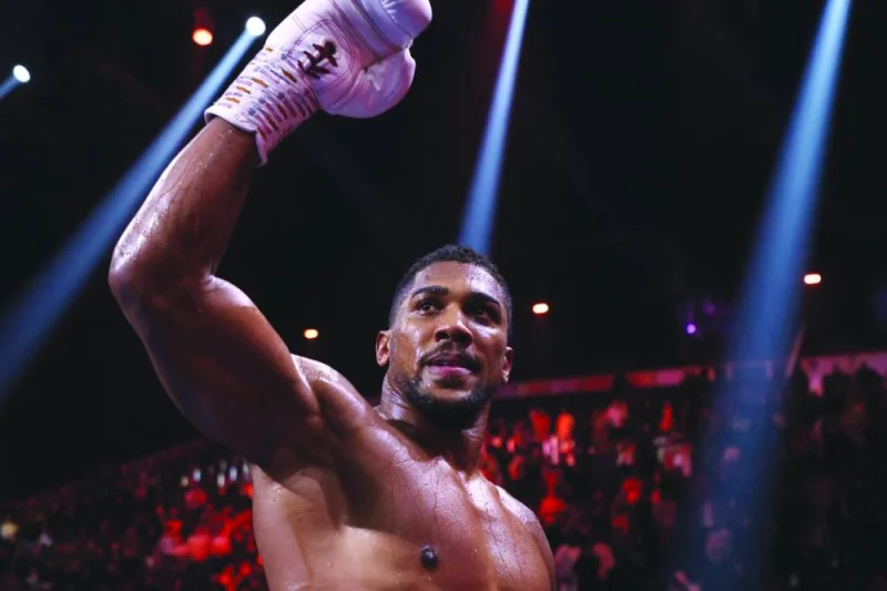 
Britain’s Anthony Joshua celebrates after defeating Sweden’s Otto Wallin during their heavyweight boxing match at the Kingdom Arena in Riyadh on Saturday. (AFP) 