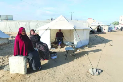 
Displaced Palestinians, who fled their houses due to Israeli strikes, shelter in a tent camp, amid the ongoing conflict between Israel and Hamas, in Rafah in the southern Gaza Strip, yesterday. 