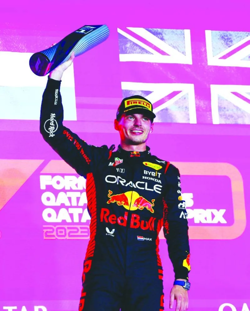 
Max Verstappen of Red Bull celebrates with the trophy after winning the Formula One Qatar Grand Prix. (Reuters) 