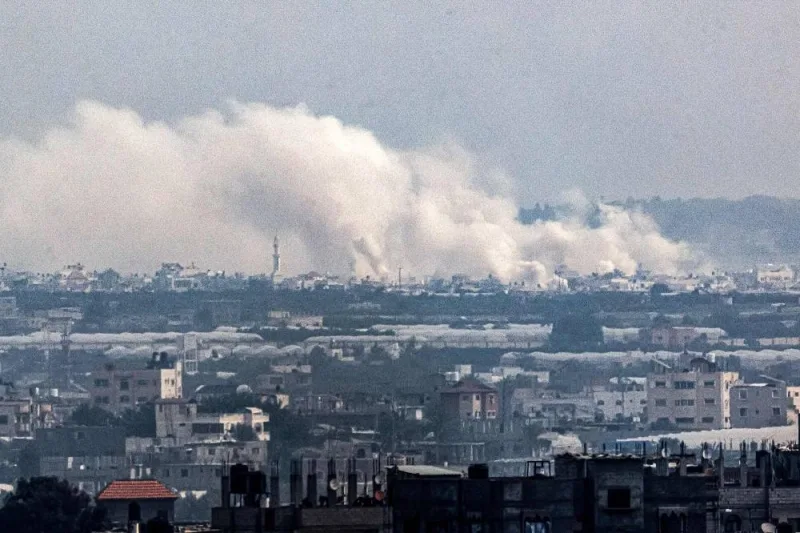 A cloud of smoke from Israeli bombardment covers the skyline of Khan Yunis from Rafah in the southern Gaza Strip, on Wednesday. AFP
