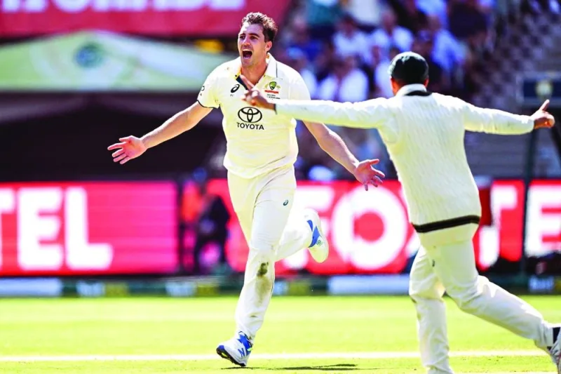 Australia’s Pat Cummins celebrates dismissing Pakistan’s batsman Babar Azam in Melbourne on Wednesday. (AFP)
