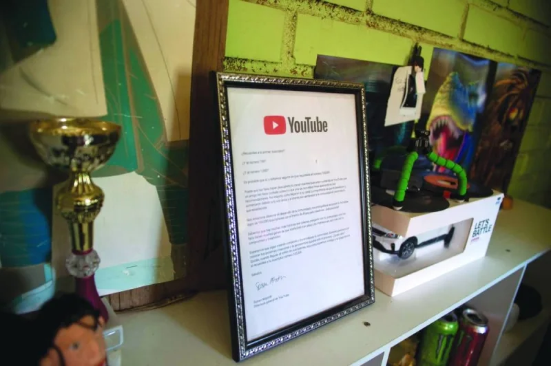 
View of a certificate from YouTube for Arevalo for having 100,000 followers. 