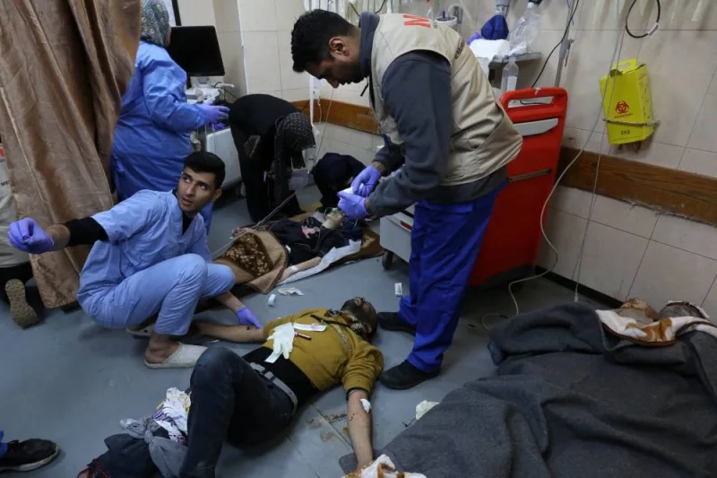People injured in an Israeli bombardment receive medical care at the emergency ward of the al-Aqsa hospital in Deir al-Balah in the central Gaza Strip on Saturday. AFP