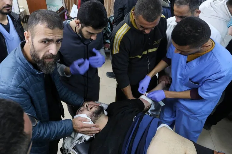 A man injured in an Israeli bombardment receives medical care at the emergency ward of the al-Aqsa hospital in Deir al-Balah in the central Gaza Strip on Saturday. AFP