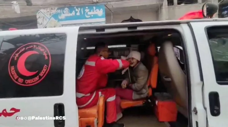 A member of the Palestine Red Crescent Society treats a Palestinian child wounded in an Israeli strike, in a location given as Khan Younis, Gaza in this screengrab obtained from a video released on Saturday. Palestine Red Crescent Society/Handout via REUTERS