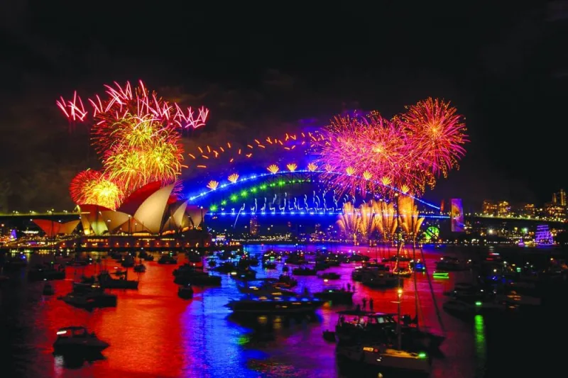 Fireworks explode over the Sydney Harbour Bridge and Sydney Opera House (L) during New Year&#039;s Eve celebrations in Sydney.