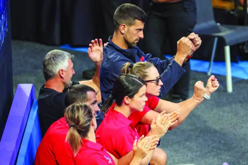 Serbia’s Novak Djokovic and teammates react as they watch Serbia’s Hamad Medjedovic and Olga Danilovic playing against Czech Republic’s Miriam Kolodziejova and Petr Nouza during their mixed doubles match at the United Cup tennis tournament in Perth on Tuesday. (AFP)
