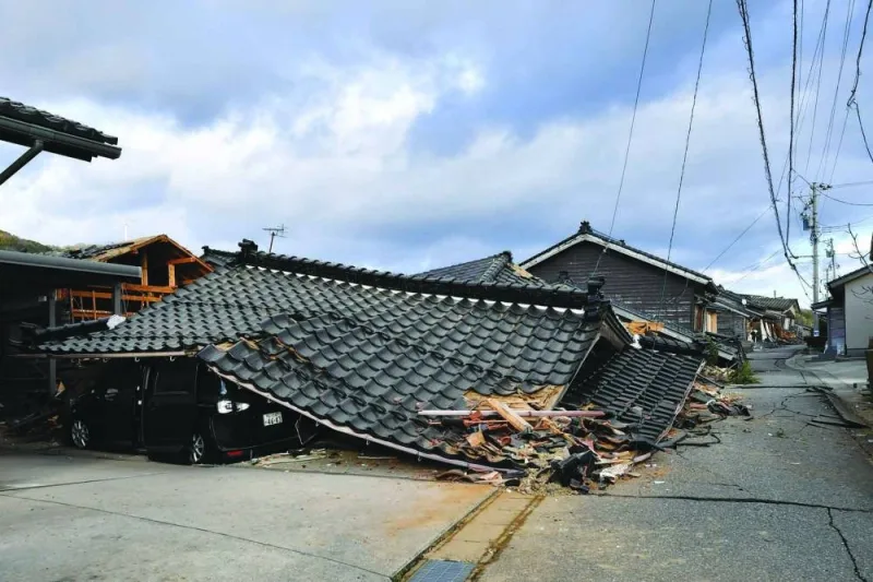 
Collapsed wooden houses are seen in Wajima. 