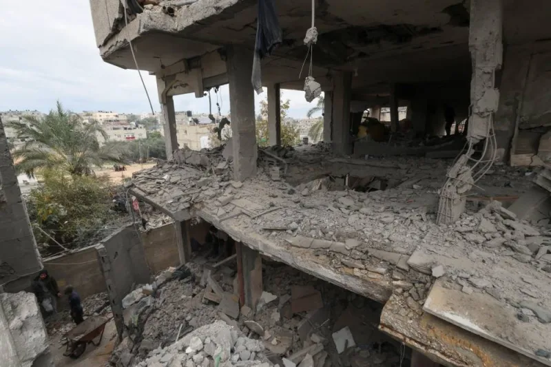 Palestinians inspect a house damaged in an Israeli strike in Rafah in the southern Gaza Strip, on Wednesday. REUTERS
