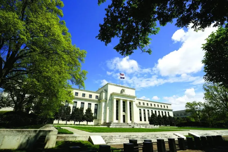
The Federal Reserve building is set against a blue sky in Washington. Financial markets are betting the Fed will begin cutting interest rates as early as March. 