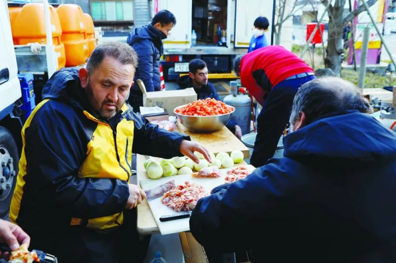 Aydin Muhammet prepares food for evacuees at an evacuation centre, in the aftermath of an earthquake, in Wajima, Ishikawa Prefecture, Japan.