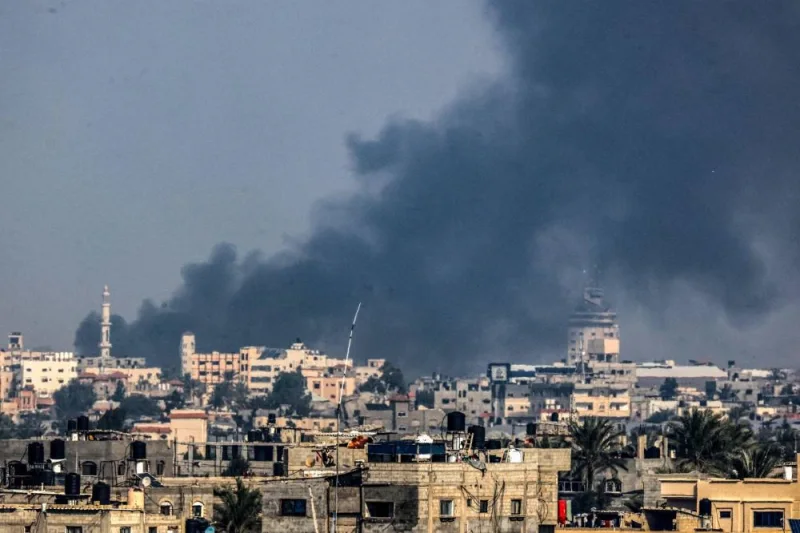 A picture taken from Rafah on Saturday shows smoke billowing over Khan Yunis in the southern Gaza Strip during Israeli bombardment. AFP