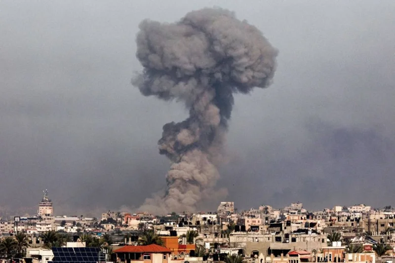 A smoke plume erupts over Khan Yunis from Rafah in the southern Gaza strip during Israeli bombardment on Monday. AFP