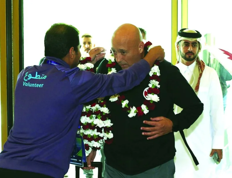 Qatar coach Marquez Lopez arrive at the Al Messila resort on Monday.