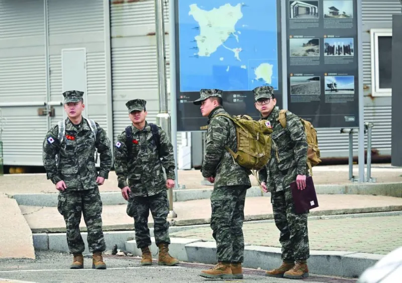 
South Korean marines are seen at a harbour on Yeonpyeong island. 