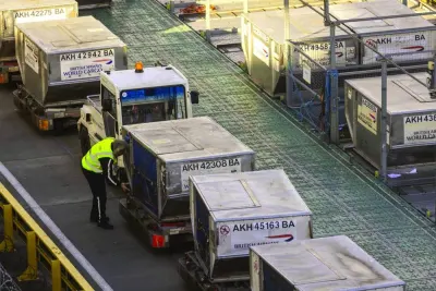 A cargo handler prepares air freight containers for a British Airways flight at Heathrow Airport in London. Air cargo is set for a positive 2024 with all regions expected to experience growth this year, according to the International Air Transport Association, the global body of airlines.
