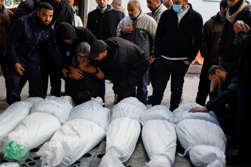Mourners react next to the bodies of Palestinians killed in an Israeli strike in Rafah, in the southern Gaza Strip, on Wednesday. REUTERS