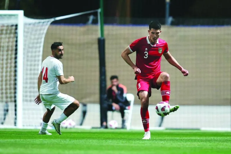 
Indonesian defender Elkan Baggott, who plays as a centre-back for EFL Championship club Ipswich Town, in action against Iran in a friendly match at the at the Al Rayyan Training Site in Doha on Tuesday. 