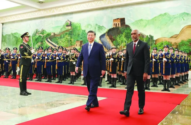 
Chinese President Xi Jinping and Maldivian President Mohamed Muizzu attend a welcome ceremony at the Great Hall of the People in Beijing. 