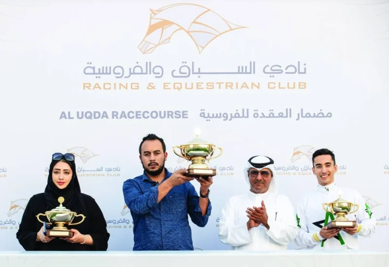 Connections of Al Harqah celebrate after winning the Al Waab Cup on Thursday. PICTURES: Juhaim