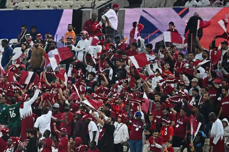 Qatar&#039;s fans cheer for their team during the AFC Qatar 2023 Asian Cup Group A football match between Qatar and Lebanon at the Lusail Stadium. AFP