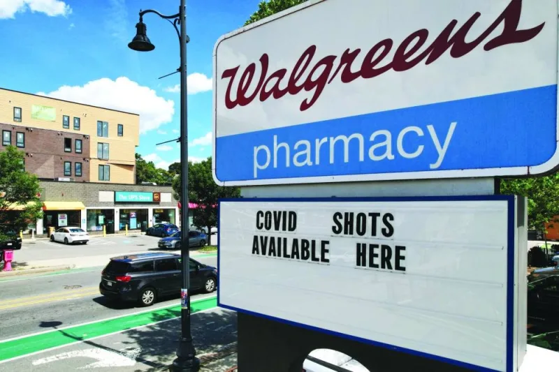 A sign advertises Covid-19 vaccine shots at a Walgreens pharmacy in Somerville, Massachusetts, US.