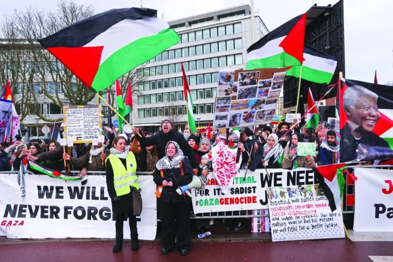 Pro-Palestinian protesters gather near the International Court of Justice (ICJ), on the day judges hear a request for emergency measures by South Africa to order Israel to stop its military actions in Gaza, in The Hague, Netherlands, yesterday.
