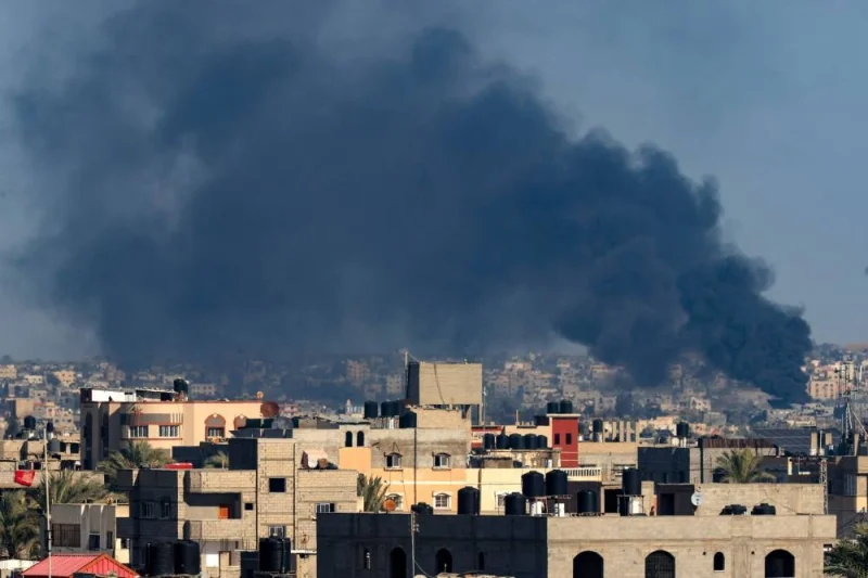 A picture taken from Rafah shows smoke billowing over Khan Yunis in the southern Gaza Strip during Israeli bombardment on Saturday. AFP 