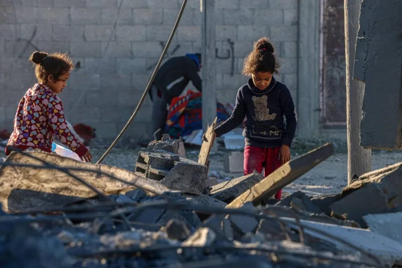 Children check the rubble following Israeli bombardment in Rafah in the southern Gaza Strip on Saturday. AFP 