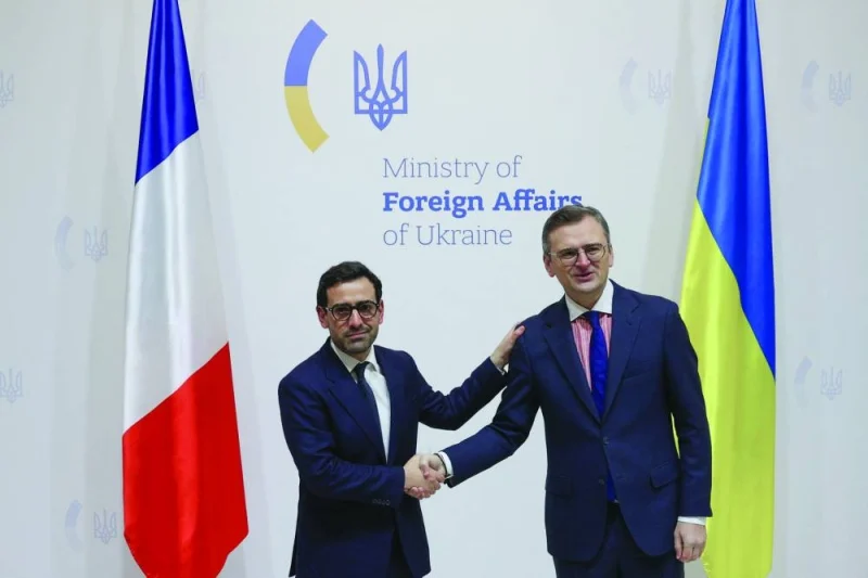 
French Foreign and European Affairs Minister Stephane Sejourne (left) and Ukrainian Foreign Minister Dmytro Kuleba shake hands during their meeting at Ukraine’s Ministry of Foreign Affairs in downtown Kyiv yesterday. (AFP) 