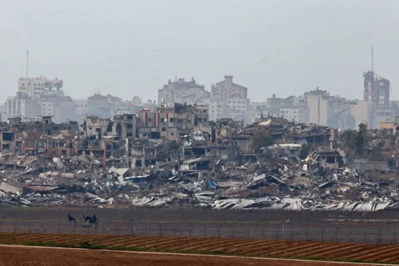 Buildings lie in ruin in Gaza as seen from Israel, on Sunday. REUTERS