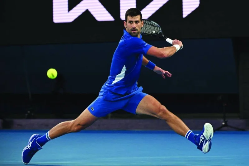
Serbia’s Novak Djokovic hits a return against Croatia’s Dino Prizmic in their Australian Open match in Melbourne yesterday. (AFP) 