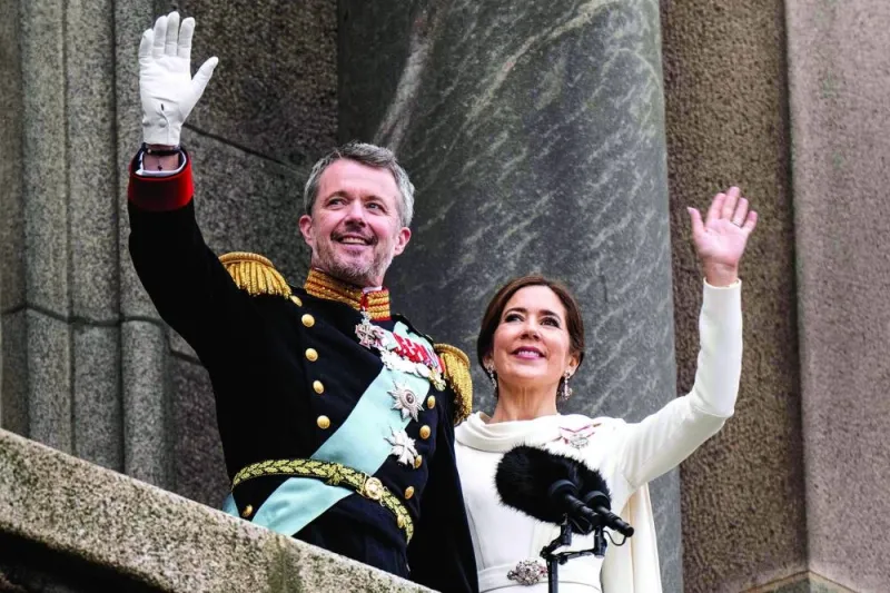King Frederik X of Denmark and Queen Mary of Denmark wave to the crowd after the declaration of the King’s accession to the throne, from the balcony of Christiansborg Palace in Copenhagen yesterday. 