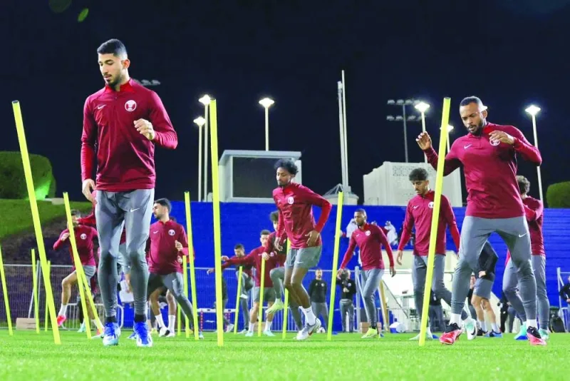 Qatar players train at the Aspire Academy on Tuesday, on the eve of their Asian Cup match against Tajikistan.