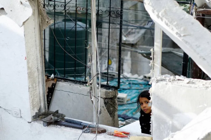 A girl looks on at the site of an Israeli strike on a house in Rafah in the southern Gaza Strip on Wednesday. REUTERS