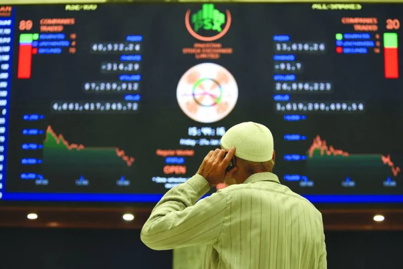 
A broker talks on phone as he watches share prices at the Pakistan Stock Exchange in Karachi (file). An escalation of geopolitical tension between Pakistan and neighbouring Iran yesterday sent ripples through Pakistan’s bonds and stocks, and raised the spectre of more pressure on the country’s struggling economy. 