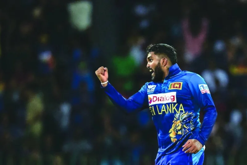Sri Lanka’s Wanindu Hasaranga celebrates after taking the wicket of Zimbabwe’s Tony Munyonga during the third and final T20I at the R Premadasa Stadium in Colombo on Thursday. (AFP)