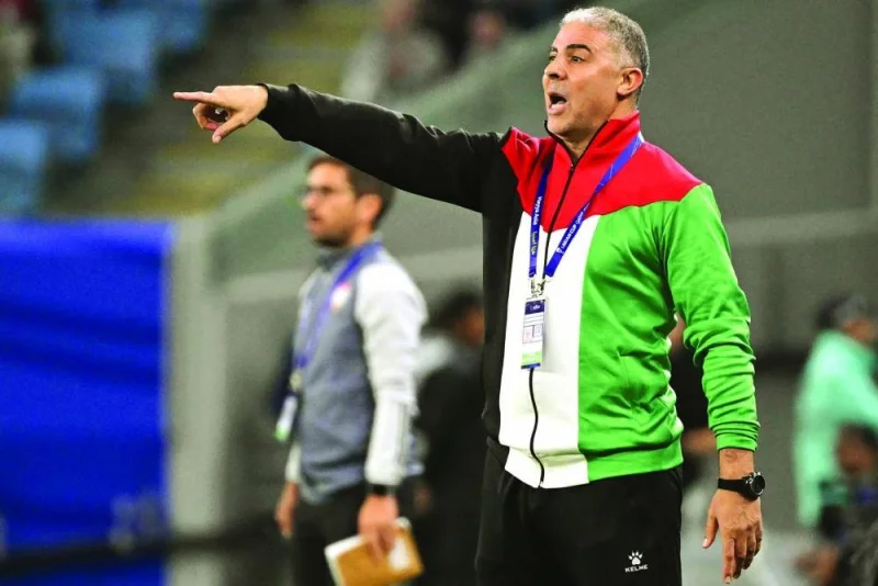 Palestine’s Tunisian coach Makram Daboub directs his players during the Qatar 2023 AFC Asian Cup Group C match against United Arab Emirates at the Al Janoub Stadium in Al Wakrah, south of Doha, on Friday. (AFP)