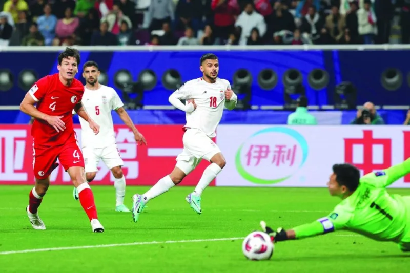 
Iran’s forward Mehdi Ghayedi (centre) looks on as he scores against Hong Kong during the Asian Cup Group C match at the Khalifa International Stadium in Doha. (AFP) 
