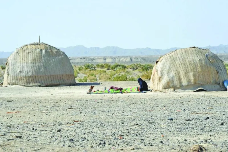 
A woman sits near her hut at the Koh-e-Sabz area of Pakistan’s southwest Balochistan province where Iran launched an air strike on Tuesday. 