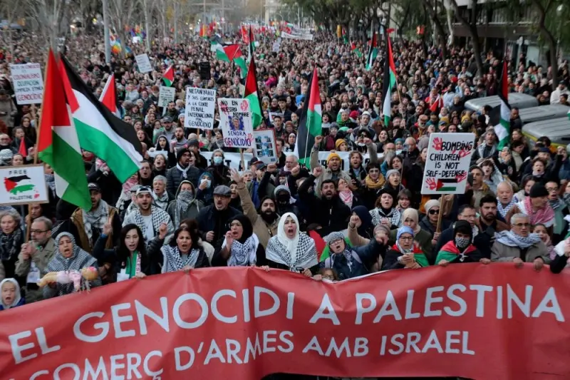 Protesters hold banners during a rally in support of Gaza, in Barcelona Saturday