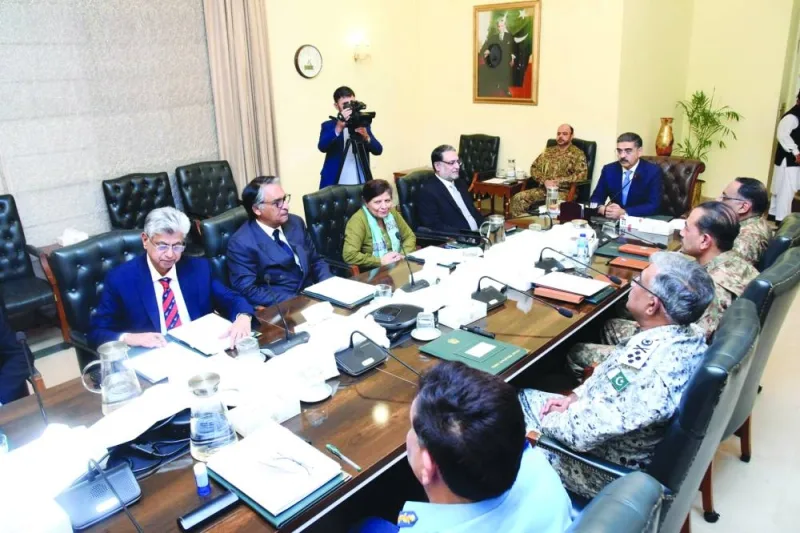 Pakistan’s Prime Minister Anwar-ul-Haq Kakar chairs a National Security Committee meeting along with armed forces chiefs and other government officials in Islamabad. Pakistan and Iran “agreed to de-escalate” tensions yesterday, Islamabad said, after trading deadly airstrikes on militant targets in each other’s territory this week. (AFP)
