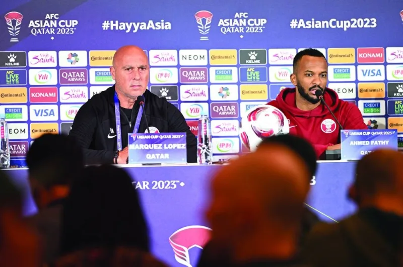 Qatar coach Marquez Lopez listens to a question during a news conference in Doha yesterday.