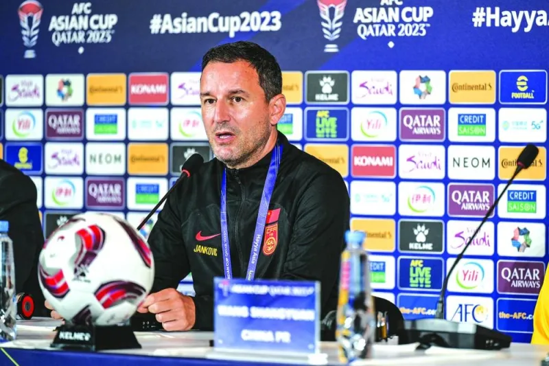 China coach Aleksandar Jankovic answers a question at a separate press conference.