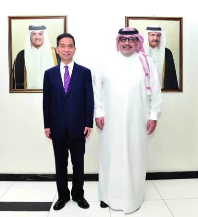 Chinese ambassador Cao Xiaolin with Faisal Abdulhameed al-Mudahka in the Gulf Times office Sunday.