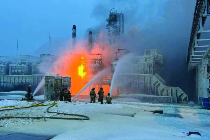 Rescuers working to extinguish a fire at a natural gas terminal in the Russian Baltic Sea port of Ust-Luga. (AFP)
