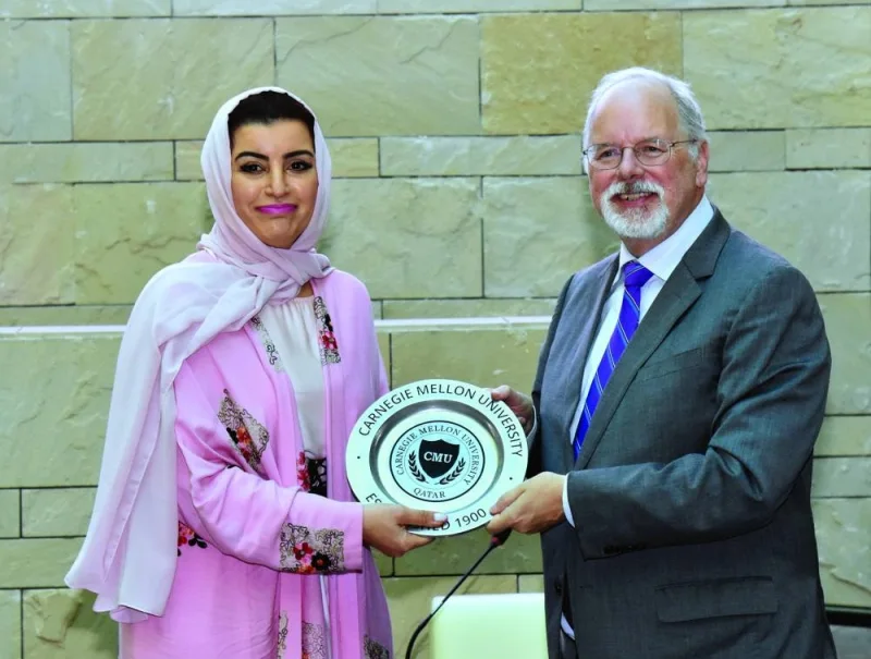 Michael Trick, dean of Carnegie Mellon University-Qatar, bestowing a token of recognition to QBWA vice chairperson Aisha Alfardan, who was the guest speaker during the latest edition of the ‘Dean&#039;s Lecture Series’ held on Monday at CMU-Q. PICTURE: Thajudheen